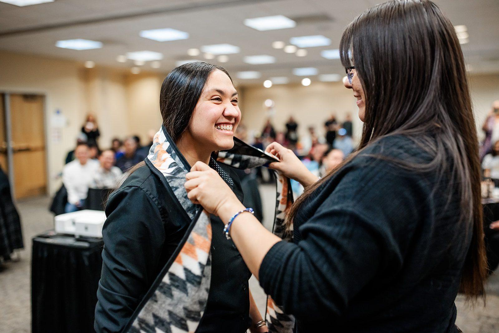 Student receiving stole at Native Indigenous Graduation